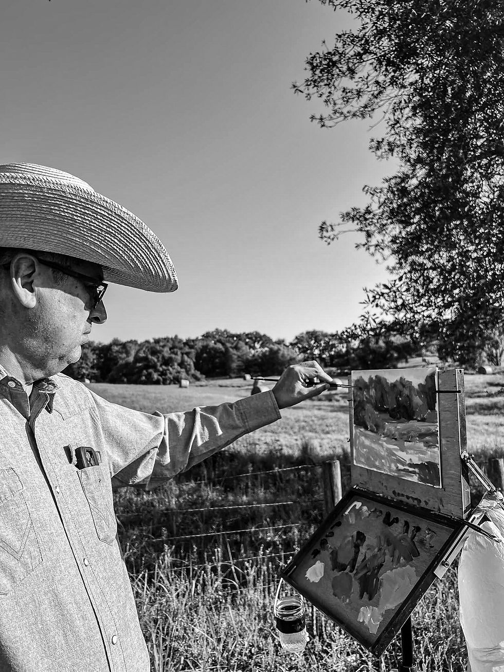 Edgar J. Sotelo painting outdoors at an easel