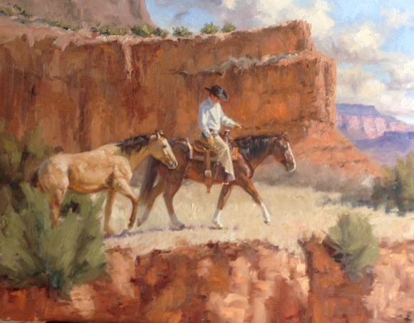 Mounted cowboy and trailing animal traveling beneath sunlit red canyon cliffs